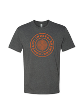 Load image into Gallery viewer, A charcoal Tee with an orange screen printed &quot;Indeed Brewing Company&quot; badge logo on the front.
