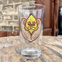 Load image into Gallery viewer, An Indeed Pistachio Cream Ale pint glass with an image of an owl on it.
