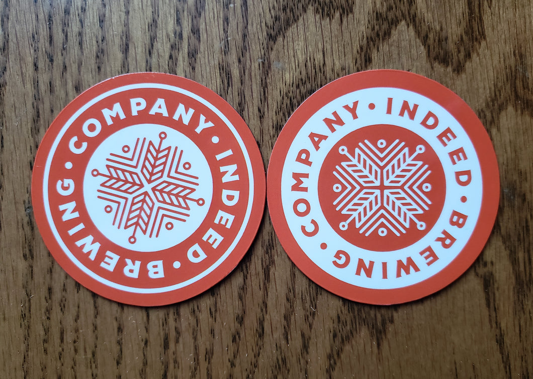 Two orange and white Indeed Logo Magnets with the words company indebted.