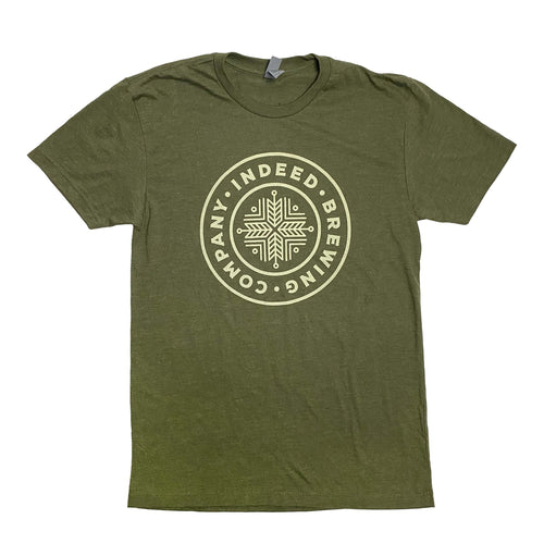 A CHUX Green Logo Tee with a white circle on it.